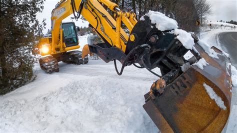 plowing snow with mini excavator|mini excavators for snow removal.